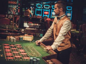 Dealer behind roulette table